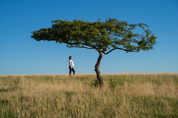 A pregnant woman with a tree.