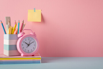 Back to school concept. Photo of school supplies on blue desk stand for pencils pens ruler alarm...