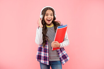 back to school. surprised teen girl in headphones. listen to music.