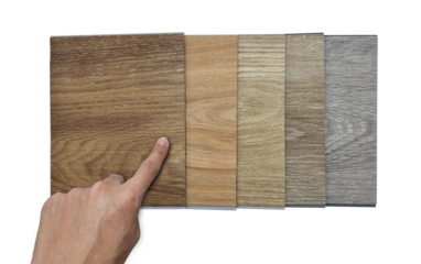 hand picking or selecting modern vinyl flooring tile chart. stack of samples of vinyl sheet catalog in multi color and texture for customer selection, isolated on background with clipping path.