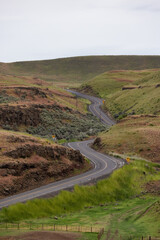 Scenic Road in the Countryside by green farm fields. Near Washtucna, Washington, United States.