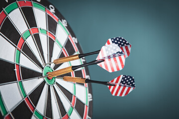 dart arrow hitting in the target center of dartboard.