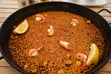 A banda rice paella with red prawns in Alicante
