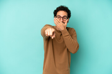 young bearded man laughing at you, pointing to camera and making fun of or mocking you