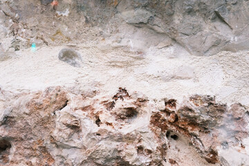 old weathered rock wall, pattern and texture, colorful background, textured surface