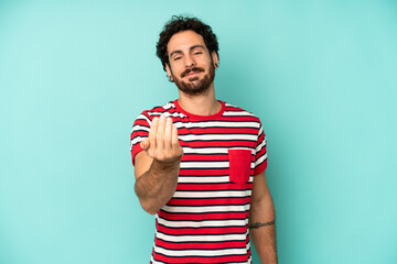 young bearded man feeling happy, successful and confident, facing a challenge and saying bring it...