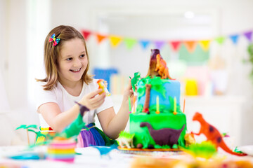 Obraz na płótnie Canvas Kids birthday party. Dinosaur theme cake.