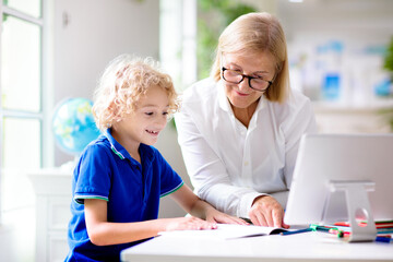 Fototapeta premium Online remote learning. School kids with computer.