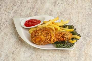 Crispy chicken leg with fry potato