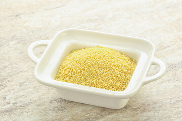 Raw couscous in the bowl