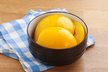 Sweet canned peaches with syrope