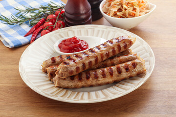 Grilled sausages with cabbage and sauce