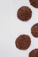 five chocolate chip cookies on white background