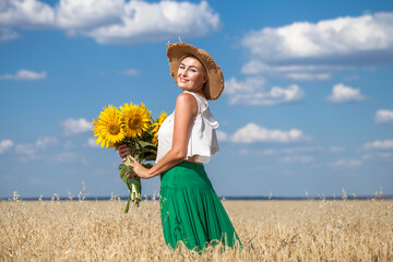 Portrait of a middle-aged woman with a bouquet of sunflowers