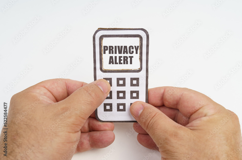 Poster in the hands of a person is a cardboard model of a telephone with an inscription on the screen - pri