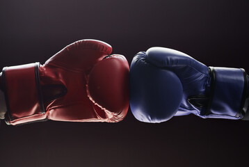 Two men's hands in boxing gloves. Confrontation concept
