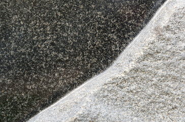 Texture of black and white granite. Close-up.