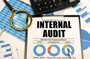 On the reporting documents, there are office items and a tablet with documents and the inscription...