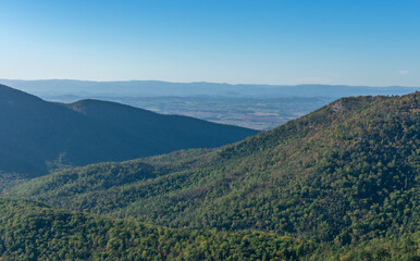Fototapeta na wymiar Blue Ridge Mountains in Shenandoah National Park sit under a clear Fall sky.