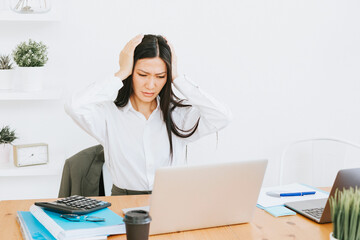 young asian business woman professional in formal wear clothes work in modern office using laptop, tablet, brainstorm and search for solutions, confident independent Asian girl solves problems