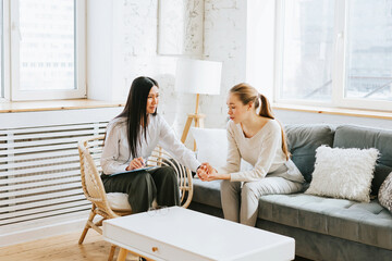 psychological consultation young Asian specialist psychologist or coach conducts a session for a...