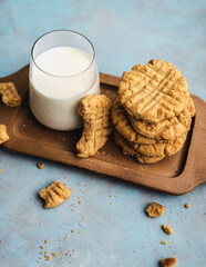 nutmeg nut butter chip cookies on wooden background glass milk