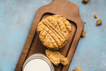 nutmeg nut butter chip cookies on wooden background glass milk