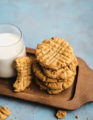 nutmeg nut butter chip cookies on wooden background glass milk