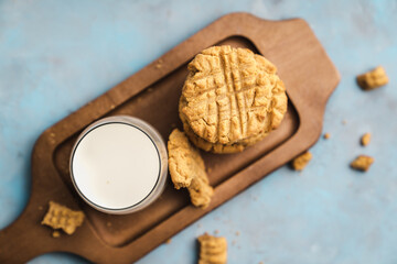 nutmeg nut butter chip cookies on wooden background glass milk