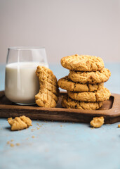 nutmeg nut butter chip cookies on wooden background glass milk