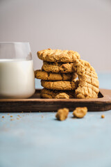 nutmeg nut butter chip cookies on wooden background glass milk
