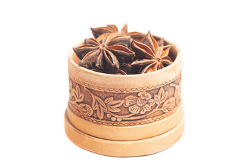 anise in a wooden box isolated on white background. Dried star anise spice fruits