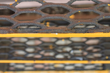 View of the old metal grate of an old steam locomotive closeup with selective focus, piece of machinery