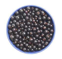 Black currants on a plate top view