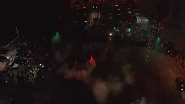 Aerial Shot Of Sports Cars Emitting Smoke During Competition On Public Road -  Los Angeles, California