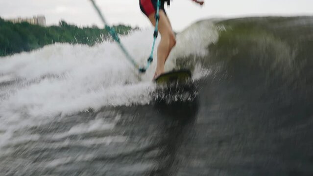 Dynamic shots of a girl on a wakeboarding board. Close-up shooting