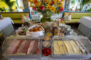 Breakfast arrangement with various food on table
