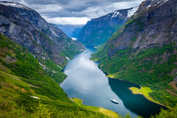 Naeroyfjord from above with ferry boat in western Norway, Scandinavia - obrazy, fototapety, plakaty