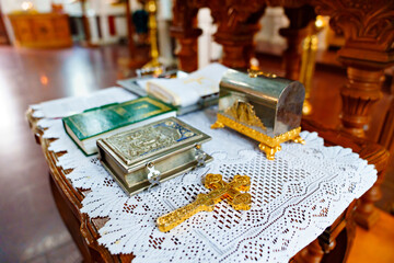 a table with traditional items for orthodox baptism in the church.