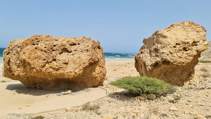 Fototapeta na wymiar big rocks near sea shore. tropical climate. beach front.