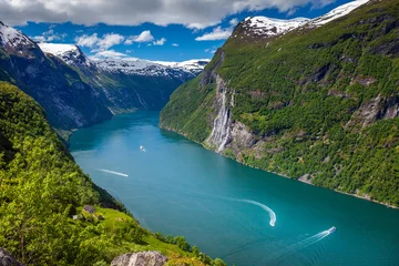 Photo sur Plexiglas Europe du nord Ferry and boats crossing Geirangerfjord Seven Sisters Waterfalls, Norway