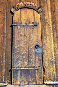 Ancient Lom Stave Church wooden door lock closed, Norway, Scandinavia