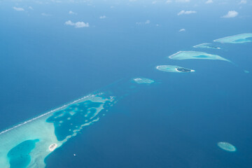 Naklejka na ściany i meble Tropical island with white sand and turquoise water in Maldives, aerial photo, top down view 