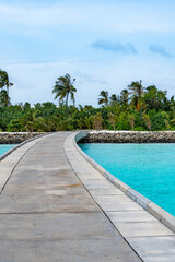 Maldives resort bridge in tropical, exotic paradise with turquoise water