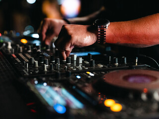 Fototapeta na wymiar a dj playing music in a nightclub