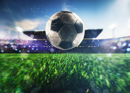 Close up of a soccer ball kicked with power at the stadium