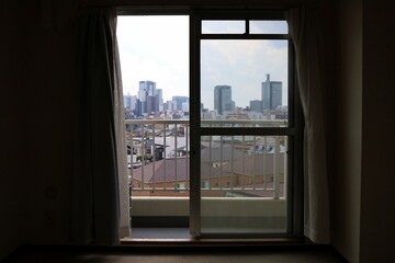 Fototapeta na wymiar The scenery seen from the window of a vacant studio apartment.Sendai City, Miyagi Prefecture Japan August 2022.