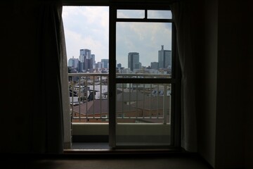 Fototapeta na wymiar The scenery seen from the window of a vacant studio apartment.Sendai City, Miyagi Prefecture Japan August 2022.