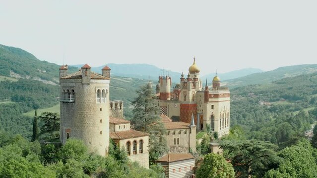 Aerial drone panoramic view of the Rocchetta Mattei castle in Italy on sunny summer day, view from above. High quality 4k footage