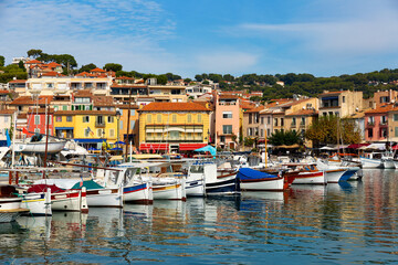 Fototapeta na wymiar View on boats in marina in bay of Cassis resort town on sunny day at Provence, France